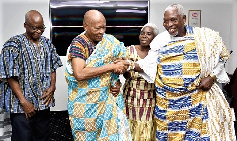 Togbi Gobah Tengey (right) decorating Nii Kwate Owoo, who was the highest bidder of the first Kente during the auctioning of the GOBTENSED book. With him are Sylvanus Gobah (left) and Alice Adjormadoh. Picture: EBOW HANSON   